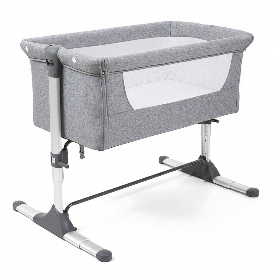 Gray baby crib with white mattress on a white background