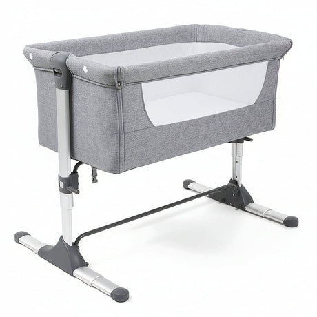 Gray baby crib with white mattress on a white background