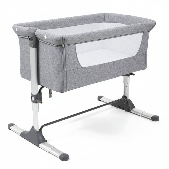 Gray baby crib with white mattress on a white background