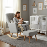Woman sitting in a rocking chair with a baby in a nursery setting