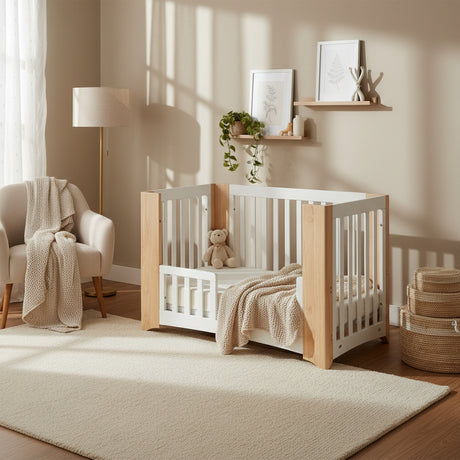 Set of four wooden cribs with white panels on a white background