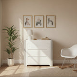 Modern interior design with a white dresser, chair, and plant in a room with neutral walls and flooring.