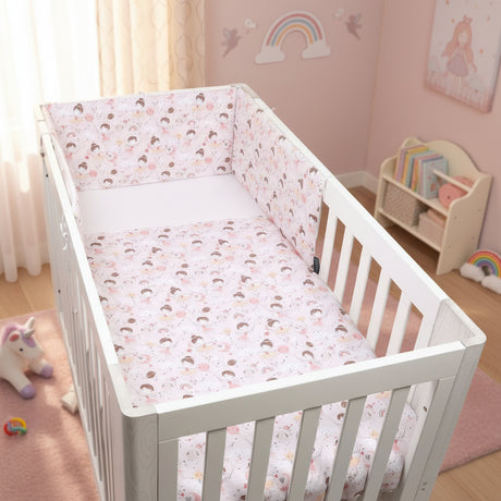 White crib with a floral-patterned bumper pad on a white background