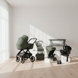 Collection of baby products including a stroller, car seat, and bassinet on a white background