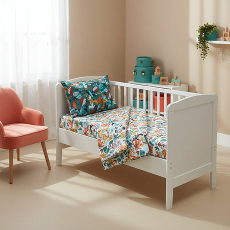 Stack of colorful patterned pillows on a rainforest background